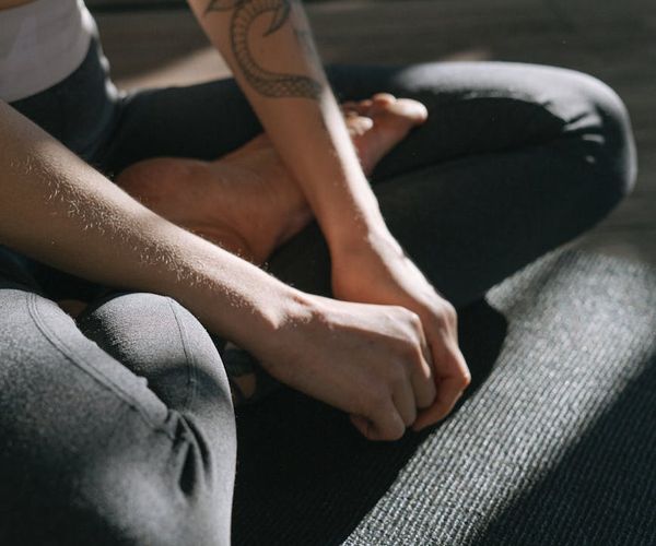 Close up of a person's hands in a meditative pose.
